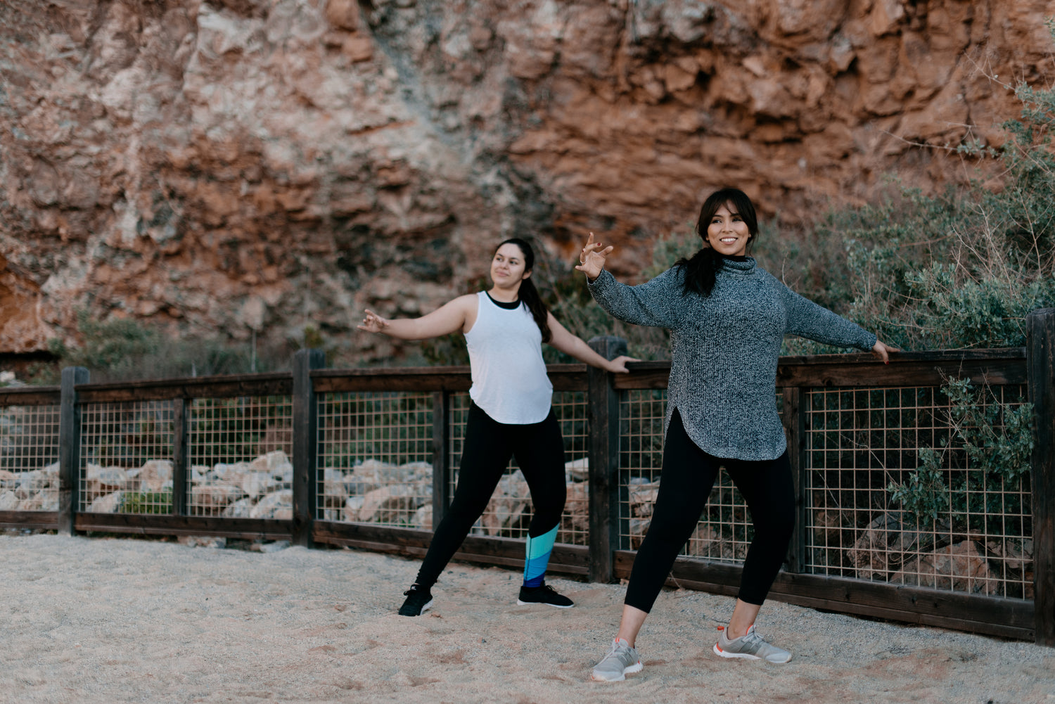 two woman exercising outdoors